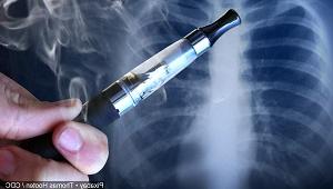 Vape pen in front of X-ray of patient's lungs